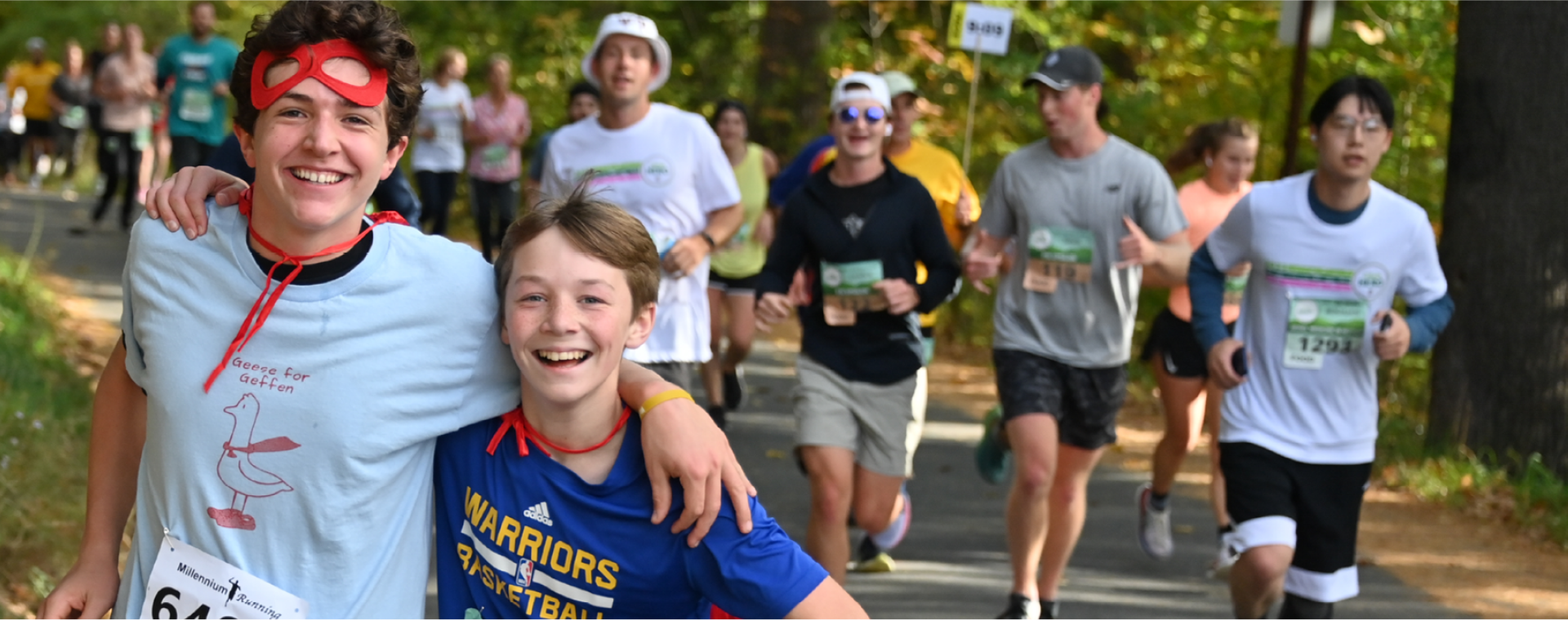 Two boys running and smiling in the CHaD event