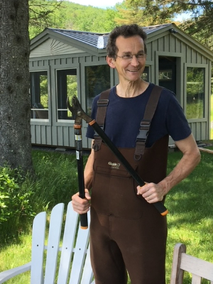 Doug looks so happy because he will be riding in the Prouty on July 13 rather than trimming brush.