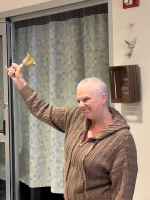 Sarah "Ringing the Bell with Purpose" after her last chemo infusion.